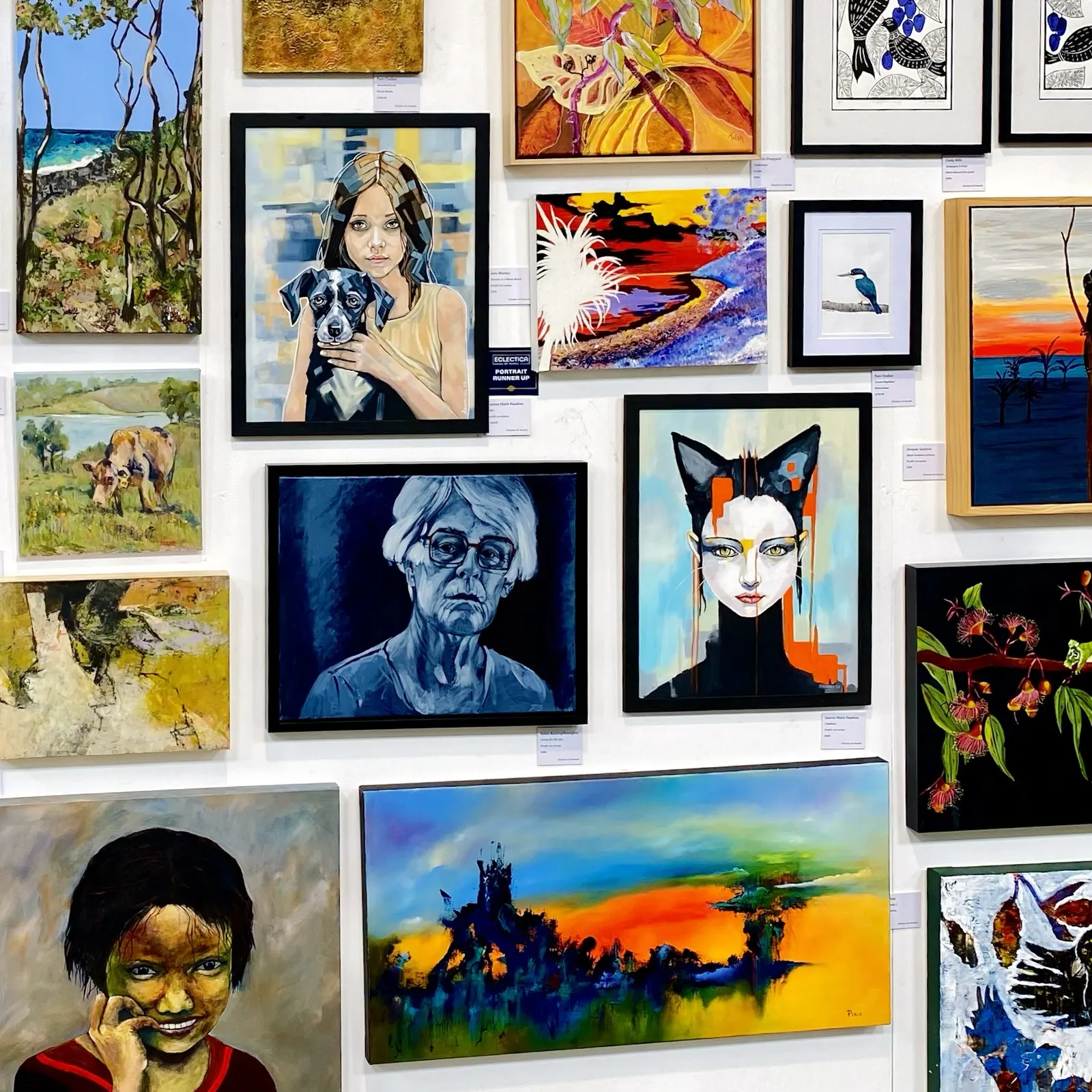 Wall of 2d artworks in gallery for art prize